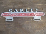 Vintage Chrysler Plymouth Accessory License Plate Topper Frame Sign Oakley Ks. Fixed Price $110.00.